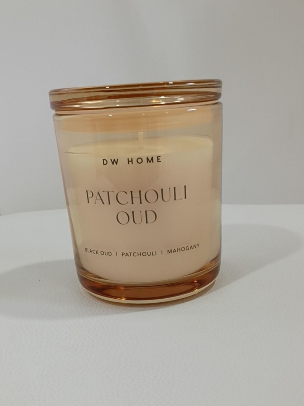 DW Home Patchouli Oud Scented Candle in Amber Glass